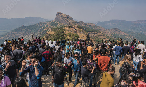 Crowded Mountain Viewpoint Attracting Visitors at Popular Scenic Destination