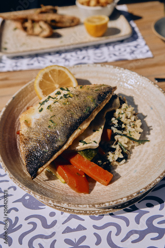 Grilled Fish Fillet with Vegetables Served at Restaurant