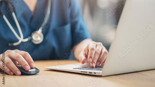 Healthcare professional working on patient documents