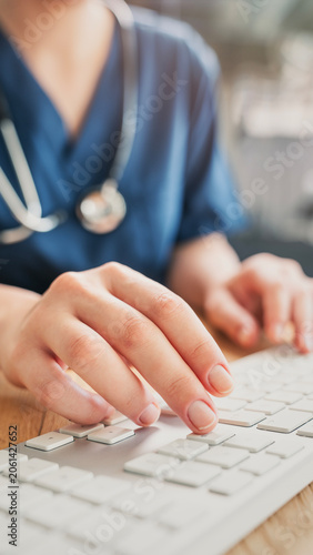 Healthcare professional working on patient documents