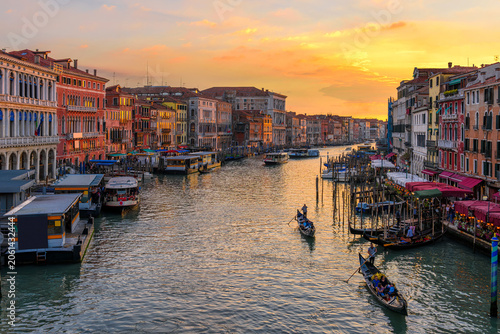 Grand Canal with gondolas in Venice, Italy. Sunset view of Venice Grand Canal...