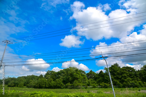The scenery of the countryside during the roadtrip with stunning scenery of Sapporo, Hokkaido, Japan. Stunning cloudscape with beautiful landscape. Nature and Travel scene.