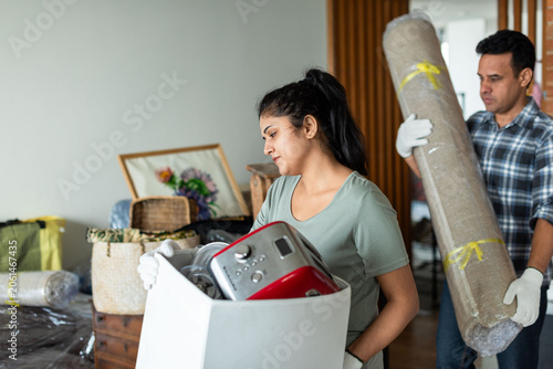 Photography Couple moving household items photo