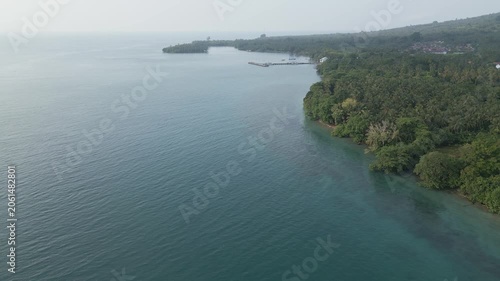 Aerial Over Sebesi Island Coastline Jetty Village And Coral Reef