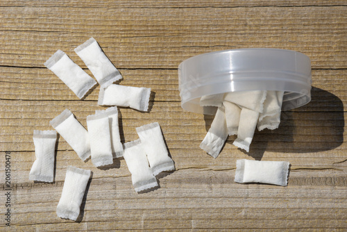 Photos nicotine pouches tobacco free snus white sachets scattered from plastic containe