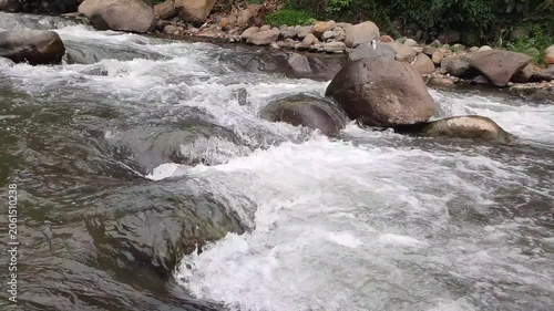 water flowing over rocks in the river