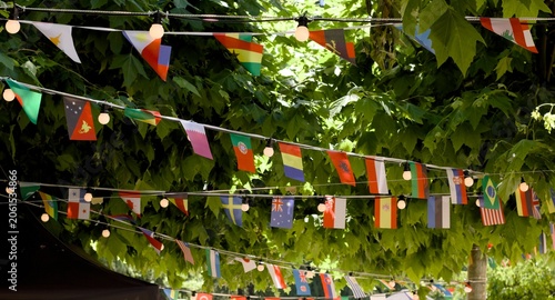 Картината върху платно Rows of world flags decorating an outdoor venue during a multicultural event
