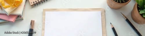 Blank paper, stationery on white table Cozy workspace , notepad, home, binder clips