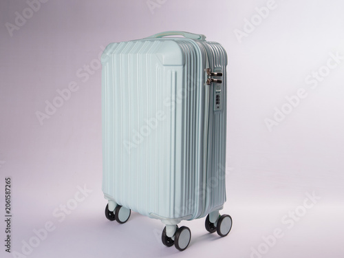 Εκτύπωση καμβά Side profile of a pastel mint green hardshell carry-on trolley
