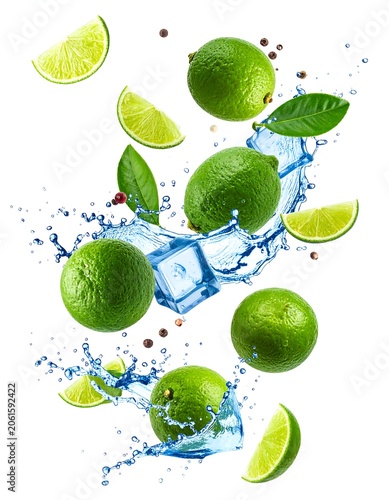 A refreshing composition of green fruits and leaves suspended in mid-air, surrounded by splashing water and ice cubes