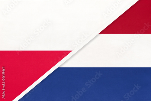 Poland and Netherlands national flags on fabric background, international partnership and cooperation between two countries