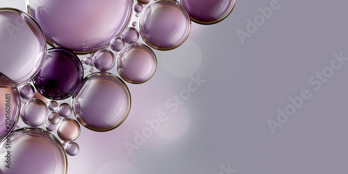 Abstract composition of translucent purple bubbles and spheres on a soft gradient background, showcasing various sizes and reflections for a modern aesthetic
