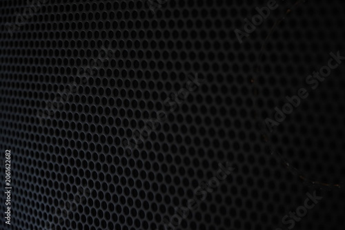 Foto Close-up of black metallic speaker grille texture background