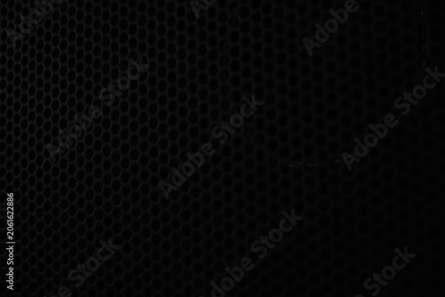 Bild auf Leinwand Close-up of black metallic speaker grille texture background