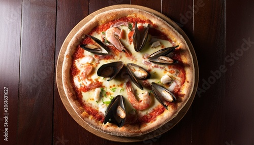pizza with seafood on wood table