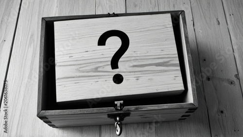 A wooden box with a question mark painted on the lid, perfect for a variety of uses from puzzle hints to curiosity piqued
