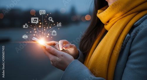 Woman using mobile phone with glowing social media and digital communication icons communication technology internet networking connectivity smartphone business application touchscreen