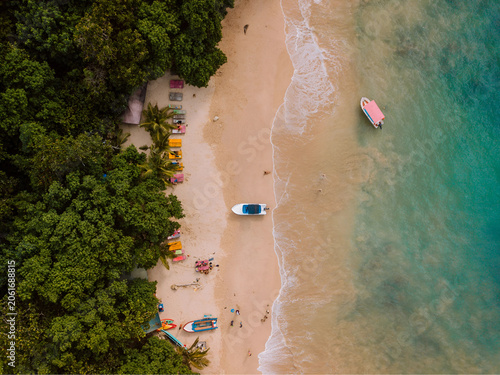 Top-Down Drone Photo of Tropical Beach – Colorful Boats, Palm Trees and Turquoise Sea