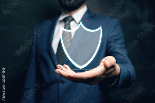 a man taps on a screen with a virtual shield