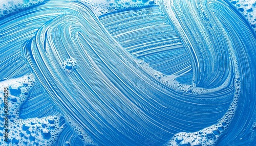 blue foam soap texture with bubbles and water wash clean background with soapy suds and detergent shampoo abstract pattern in bath and laundry
