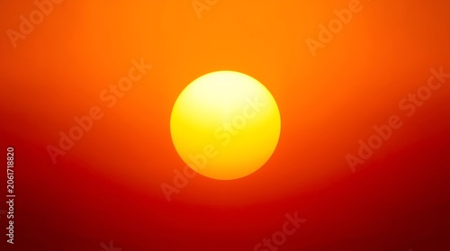 Vibrant Sunset - A Glowing Orb in the Orange Sky.