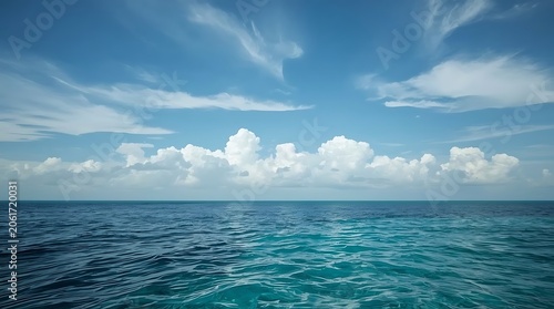 Beautiful Blue Ocean Water Under a Bright Cloudy Sky.
