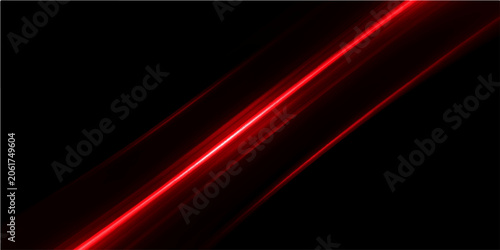 A stark crimson laser beam cuts across a deep black void, its vibrant glow creating dynamic streaks of light and shadow.