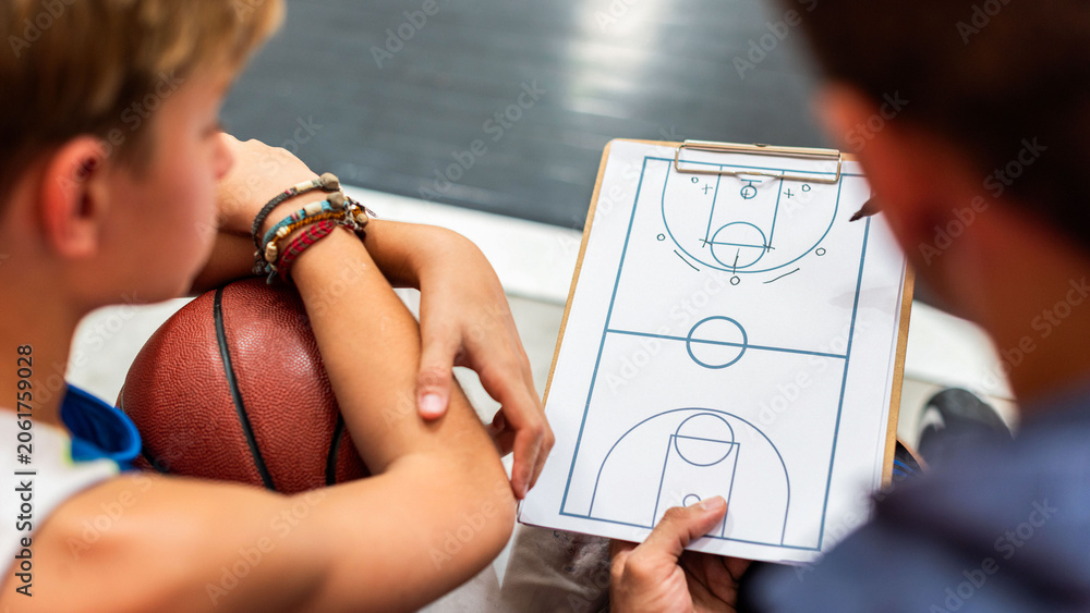 Naklejka premium Basketball strategy session with coach and player