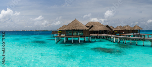Photos Thatched villas on stilts connect by wooden boardwalks in Maldives