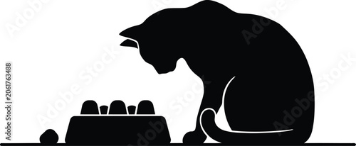 Tableau sur toile Black silhouette of a cat playing with a puzzle feeder toy on the floor silhouet