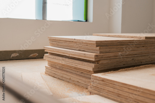 Stack of wooden boards on a construction site, building materials plywood board