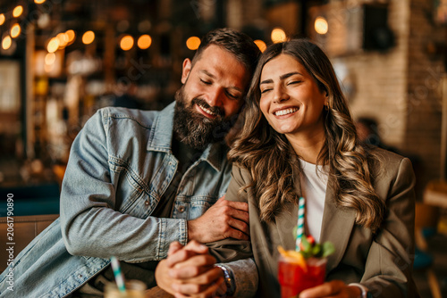 Εκτύπωση καμβά Happy couple enjoying a romantic date at a cafe