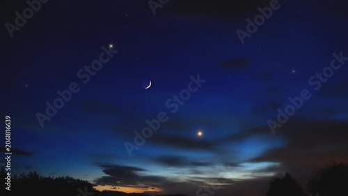 Constellations, stars, planets, Moon a on a countryside skies.