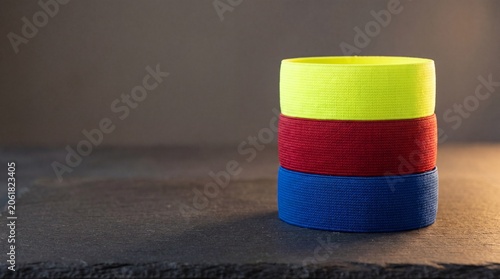 Stack of Professional Colorful Rigid Athletic Kinesiology Strapping Tape Rolls