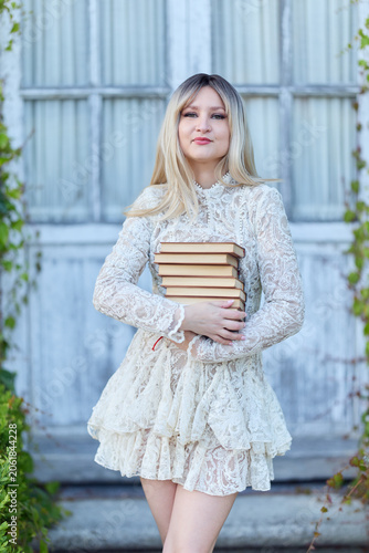 Portrait Of Woman Holding Books