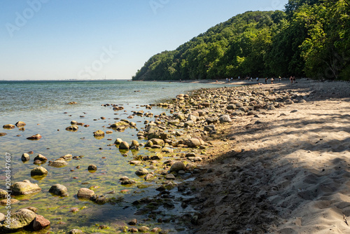 A beach on the Baltic Sea, the atmosphere of the sea, waves at the shore, stones in the water
