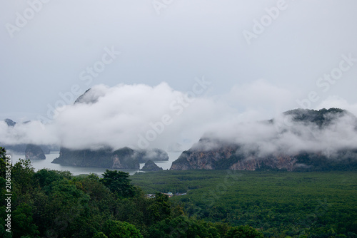 Obraz na płótnie Aerial view Hong green lush tropical island and Phang Nga bay with fog, melancho