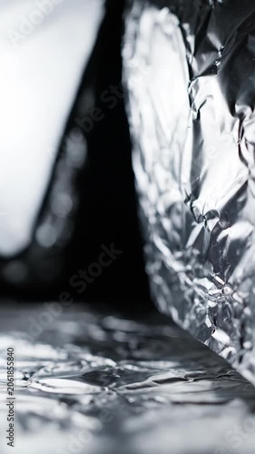 Crumpled foil fabric texture with soft shadows and highlights