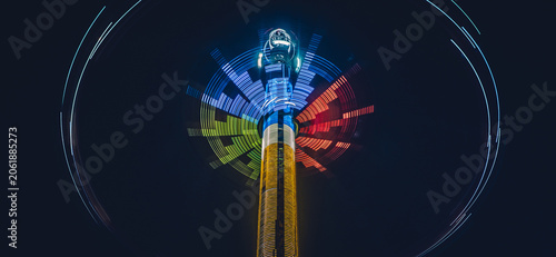 Canvas Print Spinning Tower Ride At Night In The Amusement Park