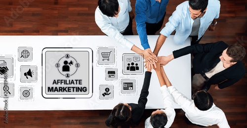 Foto A diverse business team collaborates on affiliate marketing strategies, using digital icons to represent key concepts during a brainstorming session