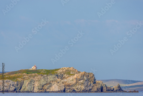 Fotografija Small old Orthodox Greek church on the rocky hill of the island of Mykonos, Gree