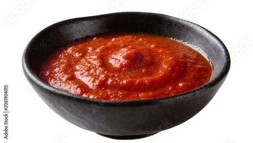 Canvastavla Thick red tomato sauce in a dark ceramic bowl, isolated on transparent backgroun