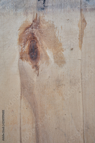 Macro view of old weathered wood surface featuring natural fiber grains, split lines, and small splinters peeling off. Grungy rustic timber board panel background 