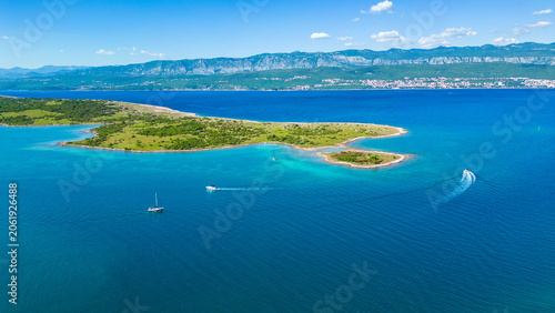 Принти на полотні Stunning aerial view of Krk Island's lush coastline and turquoise Adriatic waters, with distant mountains and a clear sky