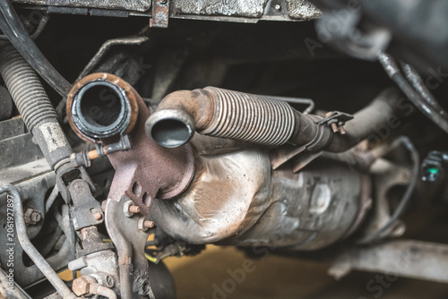 Принти на полотні Close-up of a rusty catalytic converter and exhaust system components