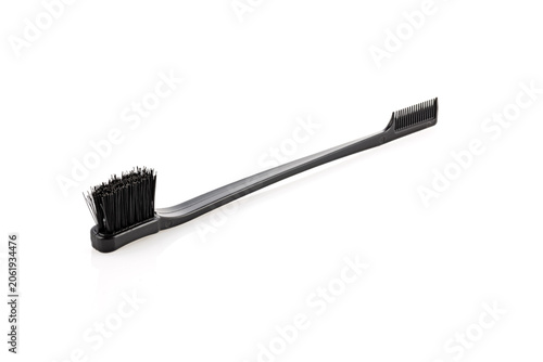 Brush with hair dyeing product isolated on white, top view
