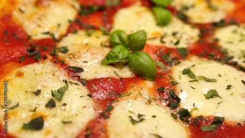 pizza with cheese and tomatoes and basil