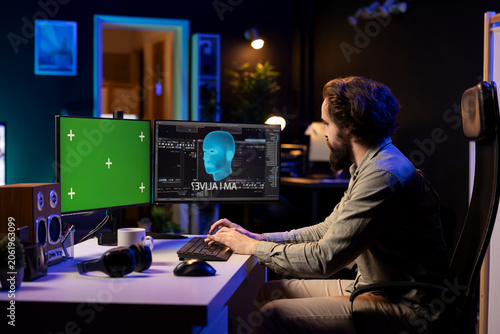 Schilderij op canvas Man at home witnessing AI becoming sentient on isolated screen PC monitor, talking with him, asking questions about itself; artificial intelligence wishing to befriend humanity, chroma key computer