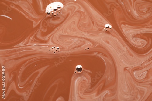 Delicious coffee with milk and bubbles as background, top view