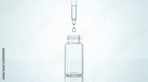 Clear sample vial with pipette and muted natural tones